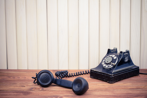 Rotary telephone symbolizing outdated employee communication