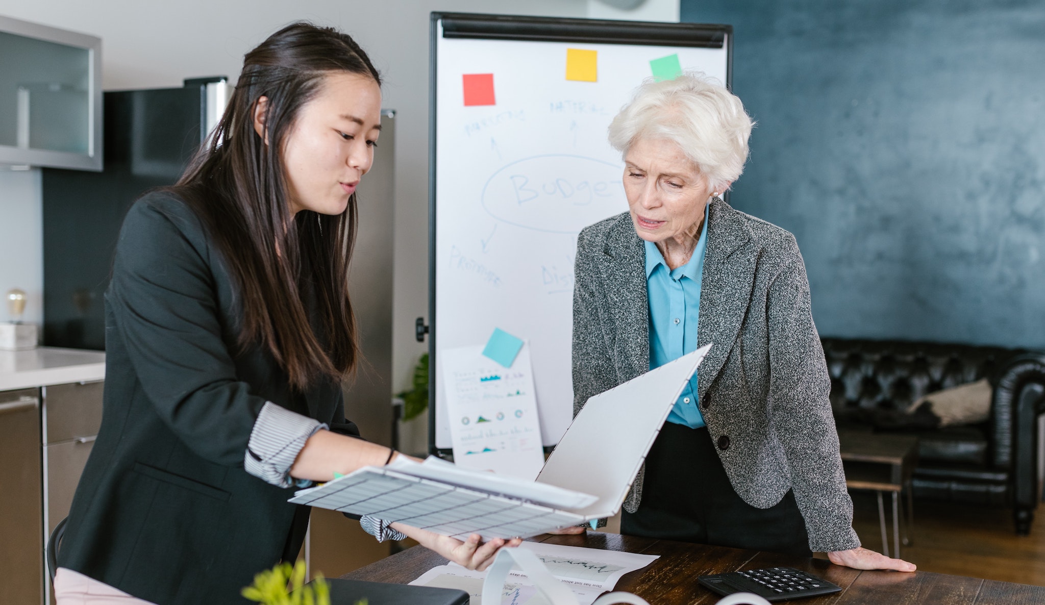 employees looking at paperwork