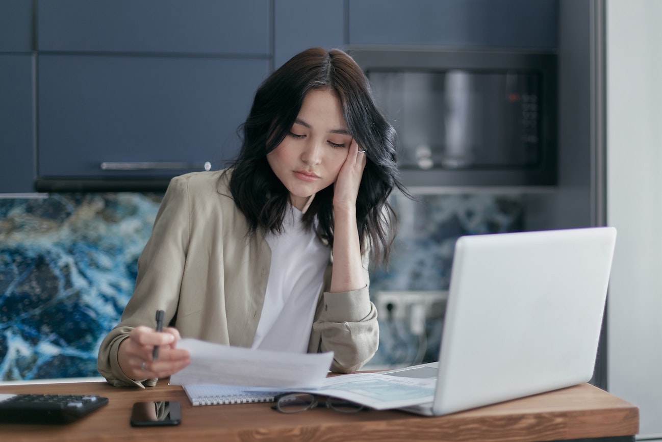 Stressed employee working at laptop