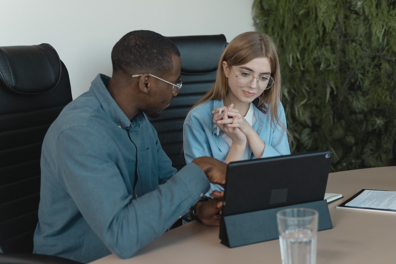 Two employees working on employee compensation strategy