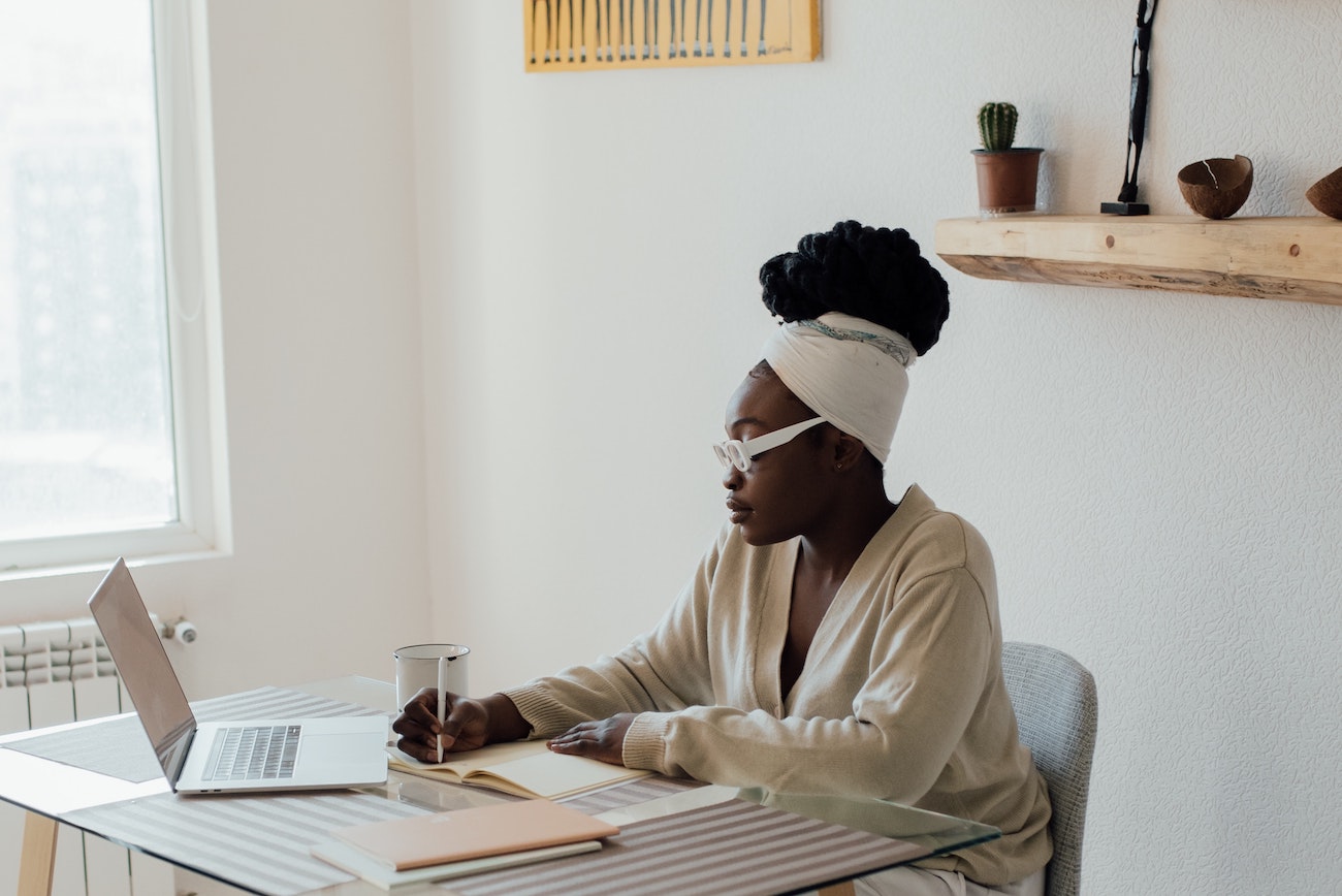 woman writing in notebook