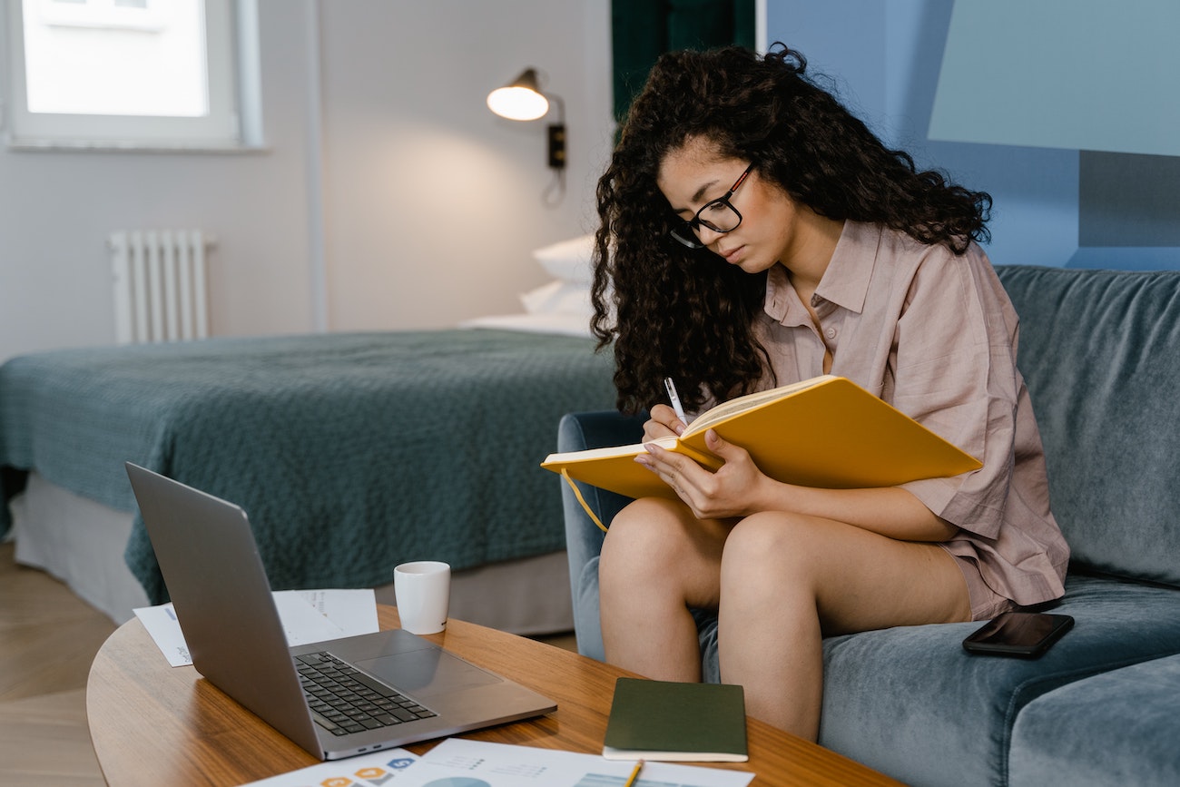 employee writing in journal